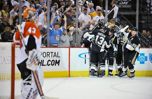 The Penguins celebrate the goal by Evgeni Malkin in the third period