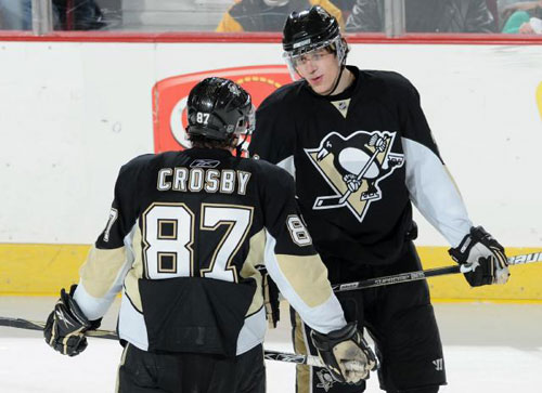 Evgeni Malkin of the Pittsburgh Penguins talks with Sidney Crosby during a timeout against the New York Rangers on January 28, 2009 at Mellon Arena in Pittsburgh, Pennsylvania.