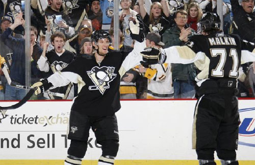 Evgeni Malkin and Mark Eaton celebrate a goal against the Lightning